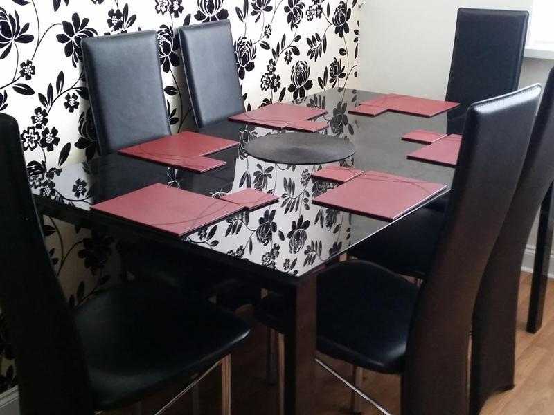 Very good condition glass table and six chairs