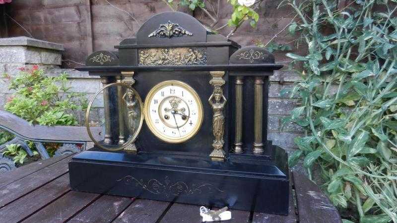 Victorian slate clock,with visible escapement.Huge ornate centrepiece.