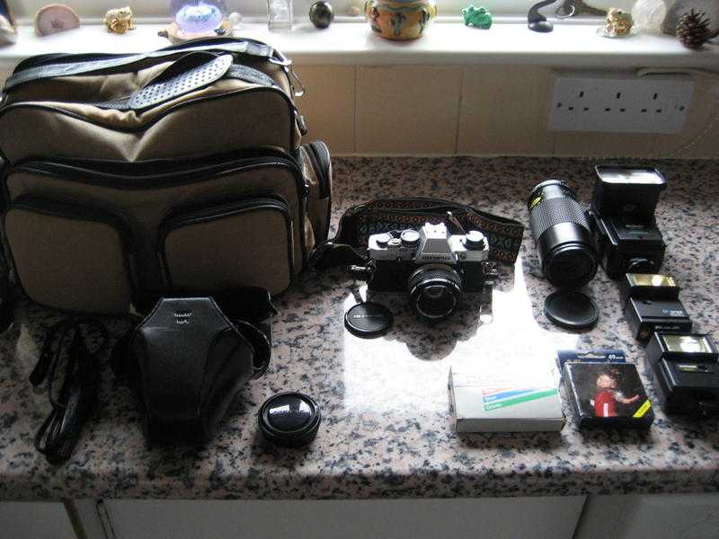 VINTAGE 1979 Olympus OM-10 for sale complete with case, filters and macro lens - Superb