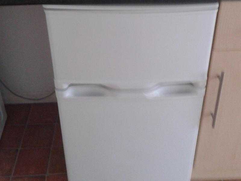 Washing machine and under the counter fridge freezer.