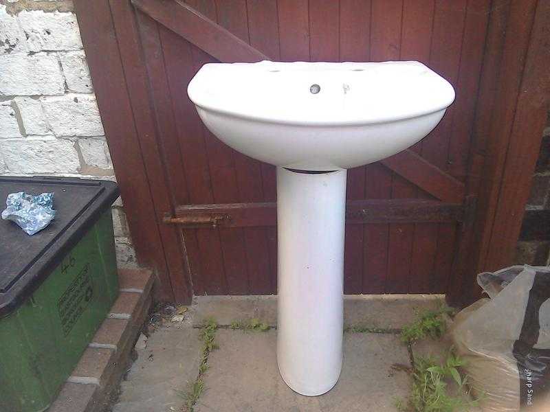 White bathroom sink and pedestal