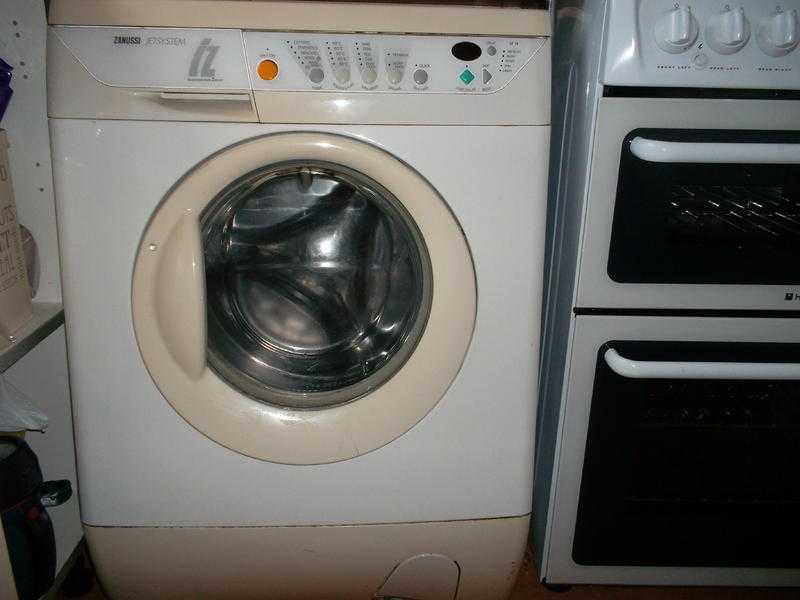 White front load washing machine, ZANUSSI IZ16, works but old