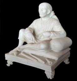 White marble art religious shirdi sai baba idol left arm on round cushion