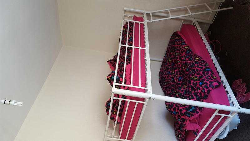 White metal bunk bed with mattress