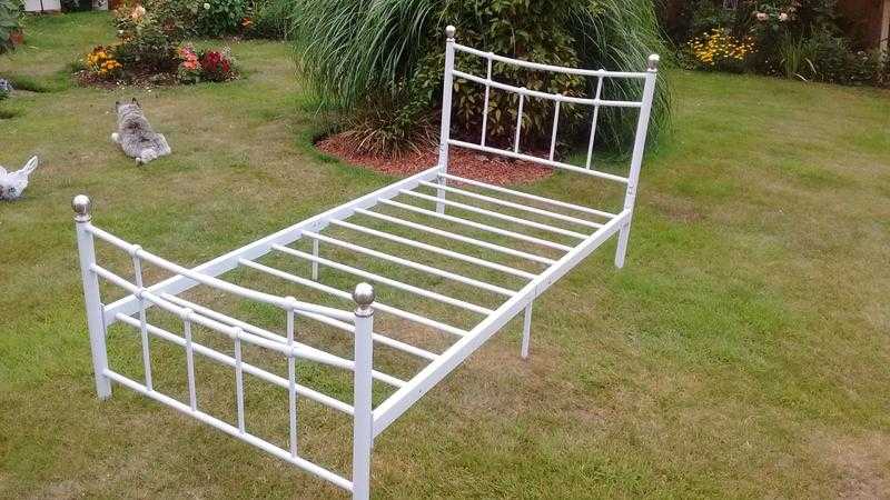 White metal frame bed