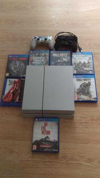 White ps4 console and games