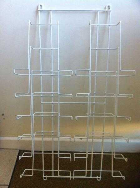 White wall mounted magazine rack