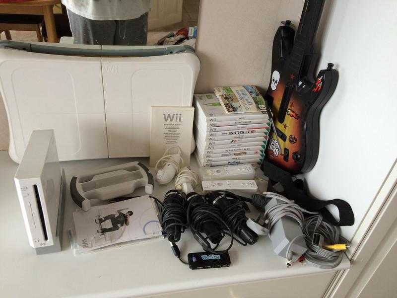 Wii Bundle with Balance board,guitar,3microphones,steering wheel,2 nunchucks,2 controllers 13 Games