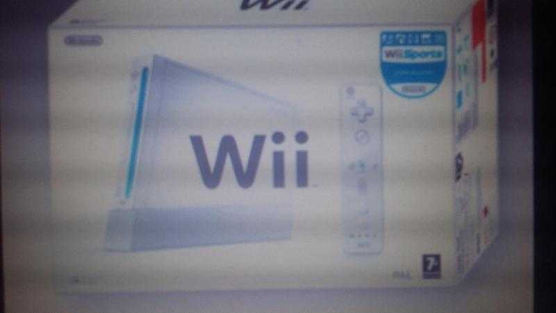 Wii console never used in a box ,two remotes ,2 nunchuk ,excercise board , and many games