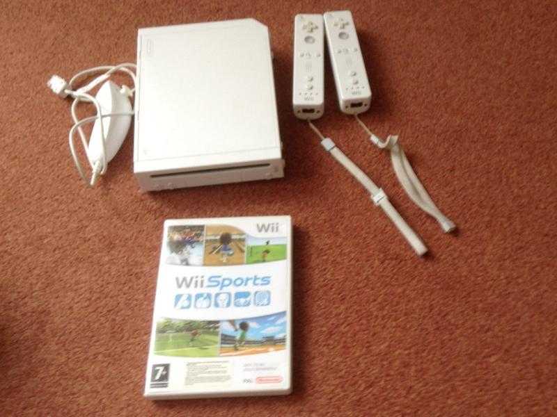 Wii console with controllers and games