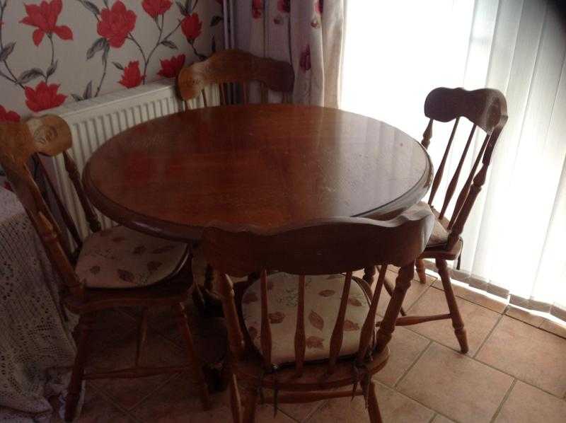 Wooden dining table and four chairs