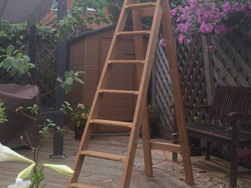 Wooden ladder painter or wedding shop prop