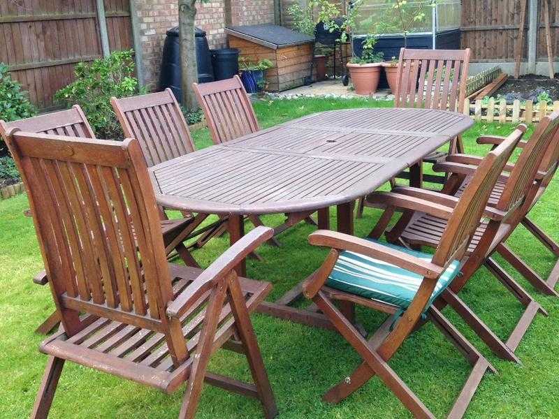 Wooden patio table, chairs and parasol