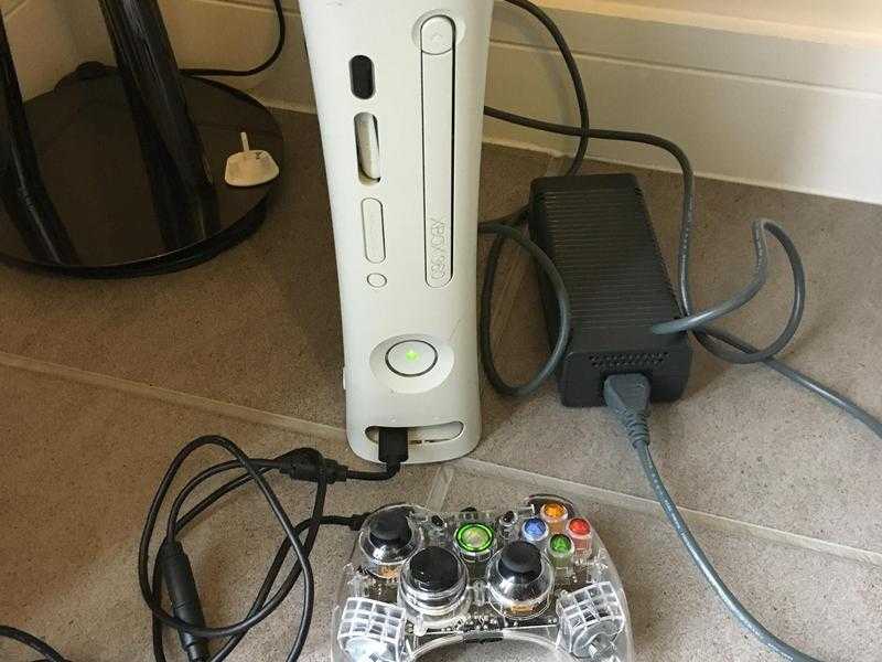 Xbox 360 with remote and clear plug in controller