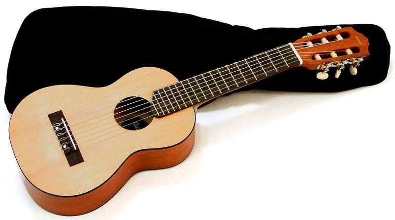 YAMAHA GL 1 GUITALELE. NATURAL. NEW IN BOX WITH GIG BAG.